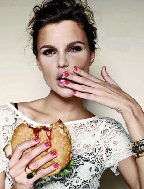 sexy girl eating a hamburger